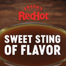One-gallon Frank's Stingin' Honey Garlic bulk bottle on prep line