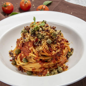 FRATELLI D'AMICO pasta puttanesca dish: assertive flavor with olive oil and tomatoes.