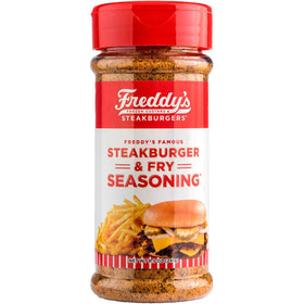 Freddy's Sreakhouse steakburger seasoning jar on kitchen counter for beef flavor.