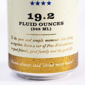 Free Bird Sparkling Southern Spring Water at a festival table, crisp bubbly hydration