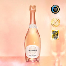 French Bloom Le Rosé glass being poured with fine bubbles.