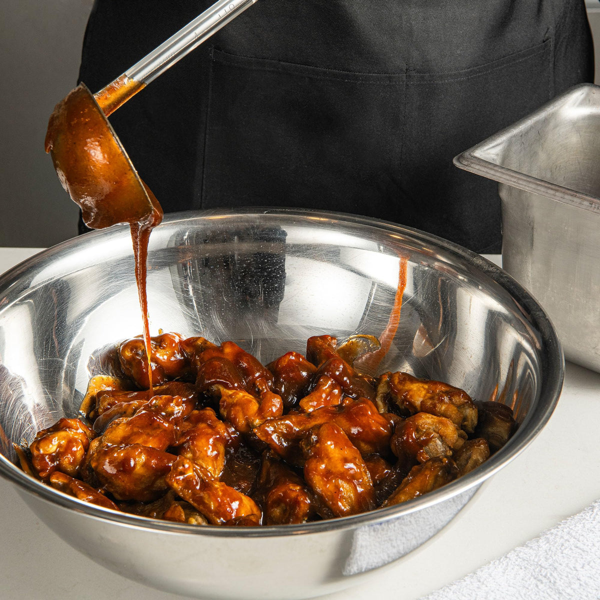 French's Sweet BBQ Sauce brushed on pulled pork for sweetness.