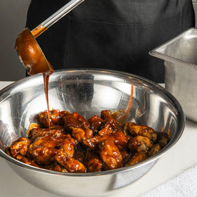 French's Sweet BBQ Sauce brushed on pulled pork for sweetness.