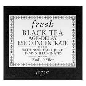 Fresh Black Tea Age Delay Eye Cream front of bottle with tea leaves