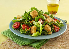 Fresh Gourmet croutons on fresh greens: golden-brown toast for a satisfying bite.