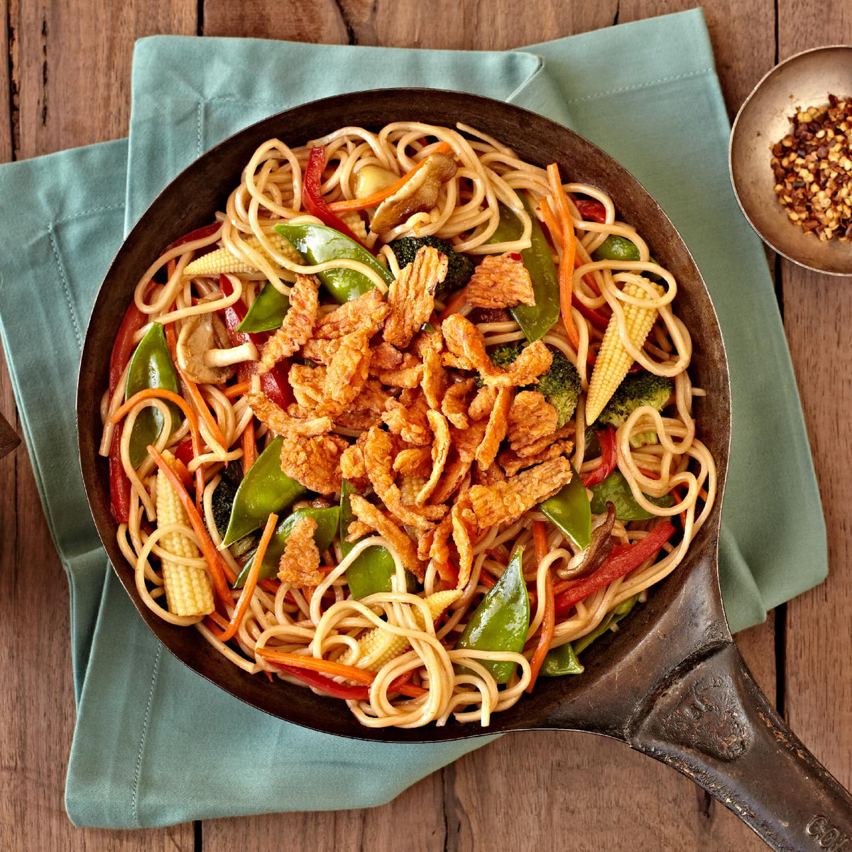 Fresh Gourmet Crispy Red Peppers topping a colorful salad for crunch and appeal.
