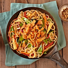 Fresh Gourmet Crispy Red Peppers topping a colorful salad for crunch and appeal.