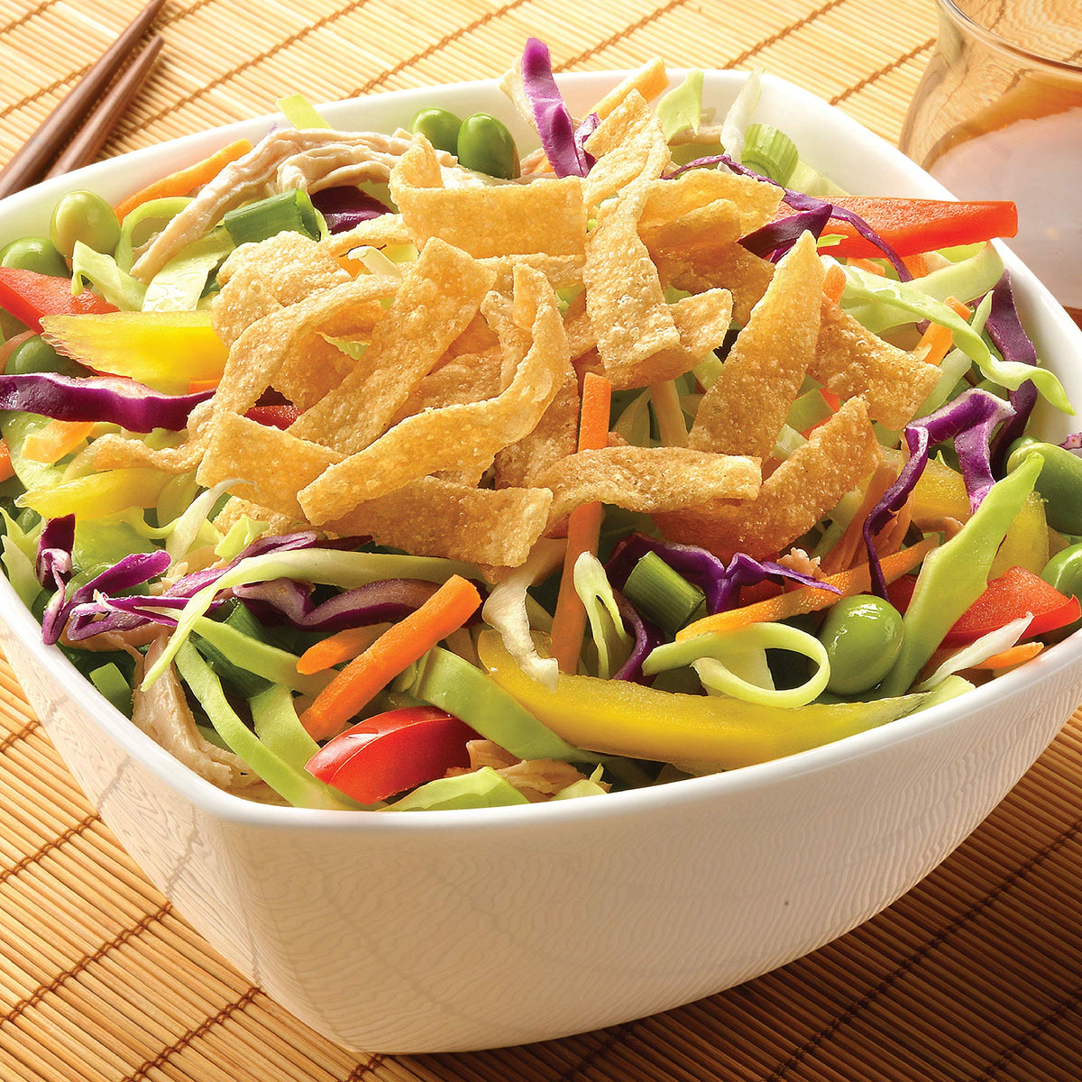 Fresh Gourmet Wonton Strips used as a salad topping for texture
