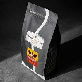 Fresh Roasted Coffee Breakfast Blend brewed cup with light roast aroma.