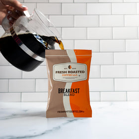 Fresh Roasted Coffee Breakfast Blend being brewed into a rich cup with aroma