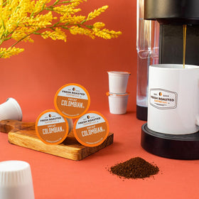 Fresh Roasted Coffee Colombian Decaf pod closeup highlights smooth flavor and balanced aroma.