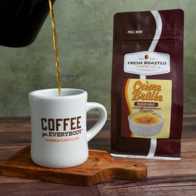 Fresh Roasted Coffee Creme Brulee bean closeup shows 100% Arabica.