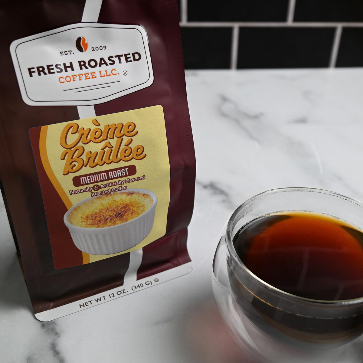 Fresh Roasted Coffee Creme Brulee cup with steam for cozy mornings.