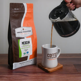 Fresh Roasted Coffee display of diverse varieties highlights extensive bean selection.