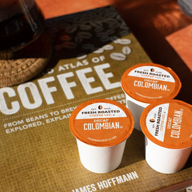 Fresh Roasted Coffee Colombian Decaf pod in a Keurig-style brewer demonstrates easy compatibility.