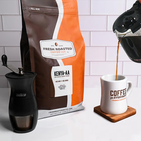 Fresh Roasted Coffee Kenya AA peach blossom notes in a cup.