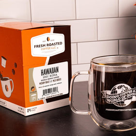 Fresh Roasted Coffee Kona pod close-up reveals rich roast color and inviting aroma.