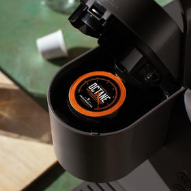Keurig-compatible Octane Italian Dark Roast pod on packaging highlighting sustainability.