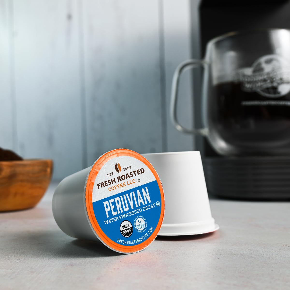 Side view of Peru decaf pack highlighting 24 pods.
