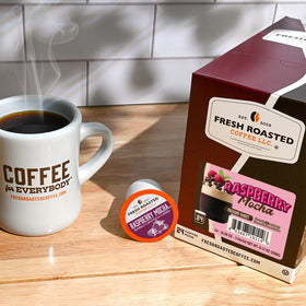 Fresh Roasted Coffee Raspberry Mocha pod closeup reveals aromatic berry and chocolate notes.
