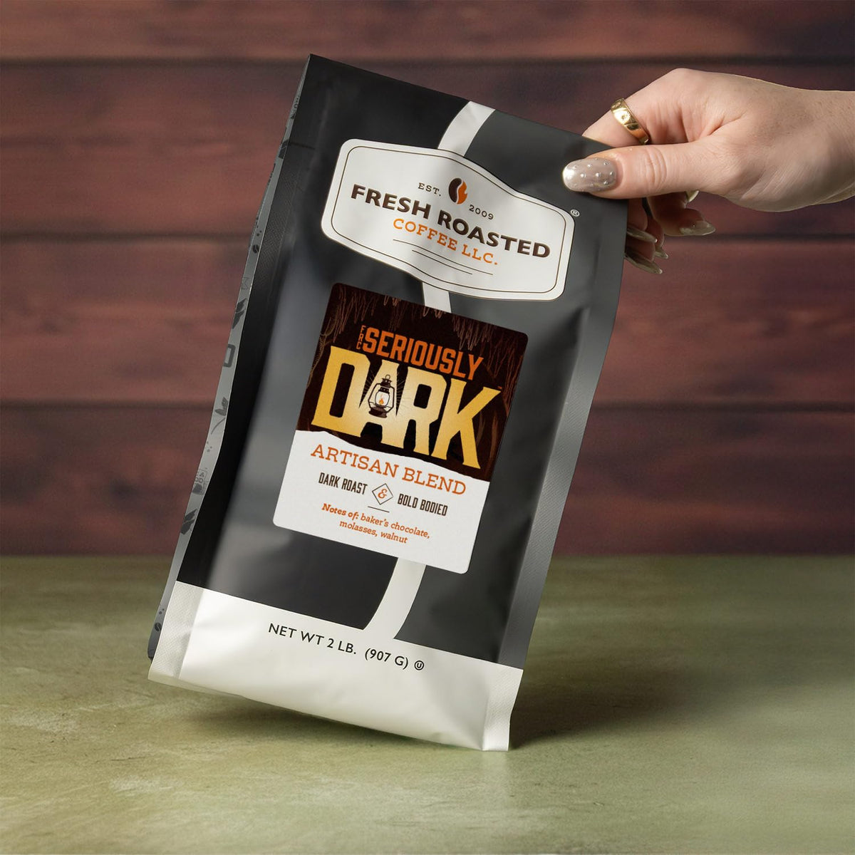 Fresh Roasted Coffee Seriously Dark Artisan Blend beans close-up highlighting glossy oils for rich aroma.