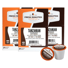 Fresh Roasted Coffee Tanzanian Peaberry light roast pod shows a convenient single-serve system with bright aroma.