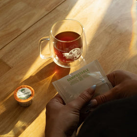 USDA Organic and Fair Trade certifications on Fresh Roasted Coffee packaging.