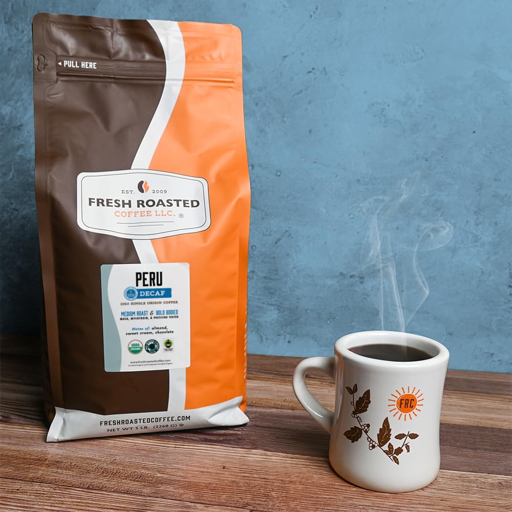 Fresh Roasted Coffee whole bean closeup showing 100 percent Arabica quality.