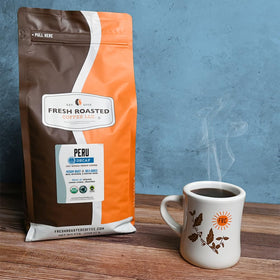 Fresh Roasted Coffee whole bean closeup showing 100 percent Arabica quality.
