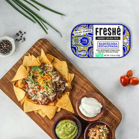 Freshé variety pack includes two Moroccan Tagine and two Barcelona Escalivada tins.