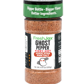 FreshJax Ghost Pepper Himalayan Salt bottle on grill adds bold heat to meats