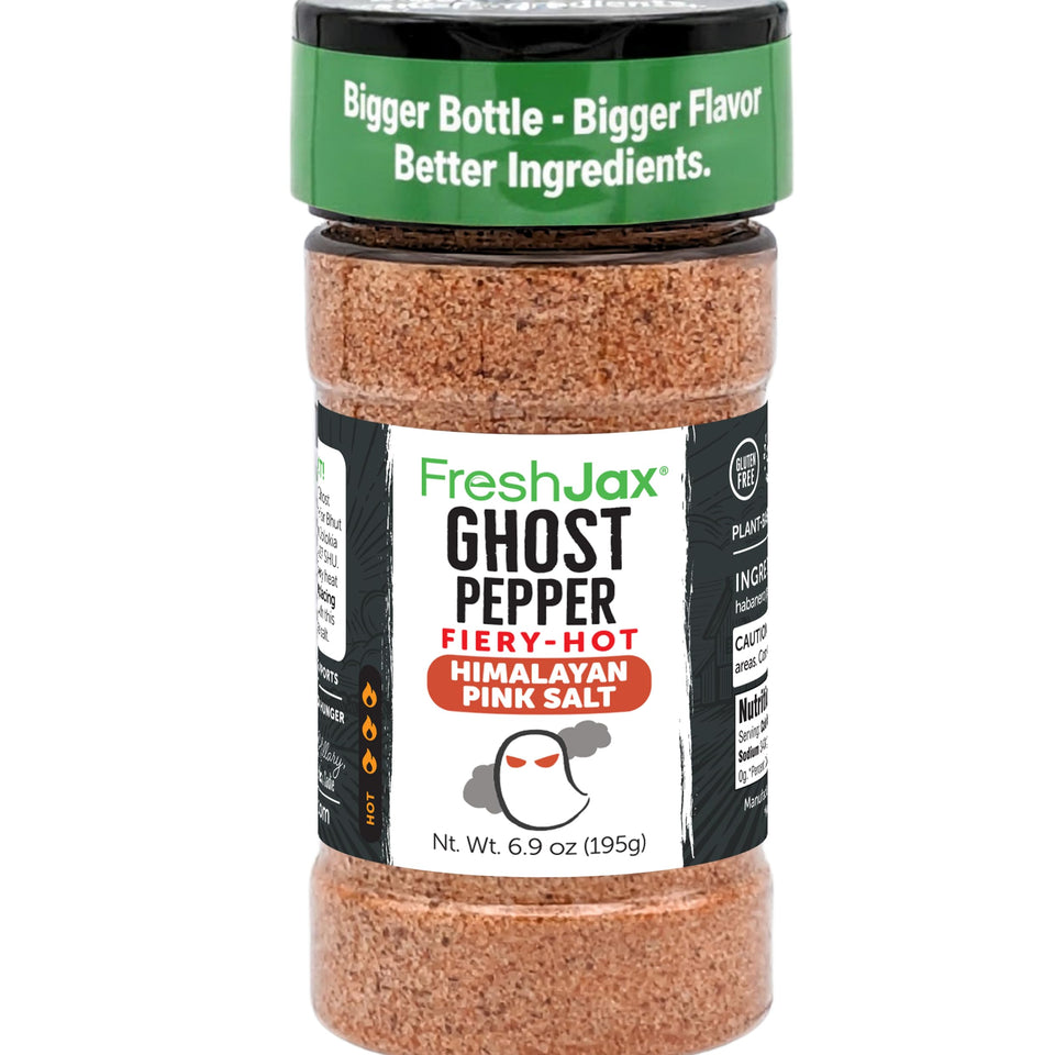 FreshJax Ghost Pepper Himalayan Salt bottle on grill adds bold heat to meats