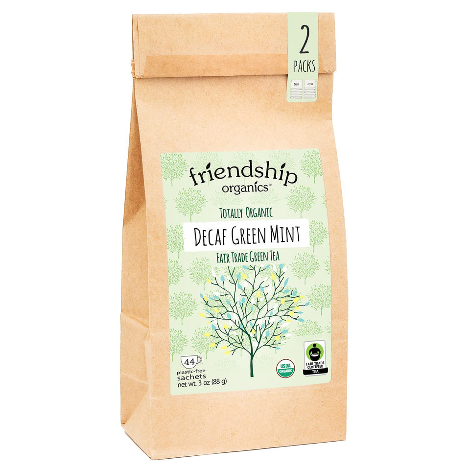 Friendship Organics decaf green mint tea bags closeup, highlighting caffeine-free mint aroma.