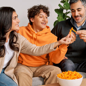 Frito-Lay Cheesy Mix Cheetos Puffs bag offers light, airy cheese bites.