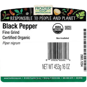 Frontier Co-op Black Pepper fine grind closeup, showcasing granular texture for precise seasoning.