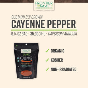 Frontier Co-op cayenne powder on a spoon for precise spice dosing.