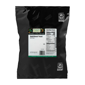 Frontier Co-op Nutritional Yeast Mini Flakes bag closeup, showcasing savory cheese-like flavor for toppings.