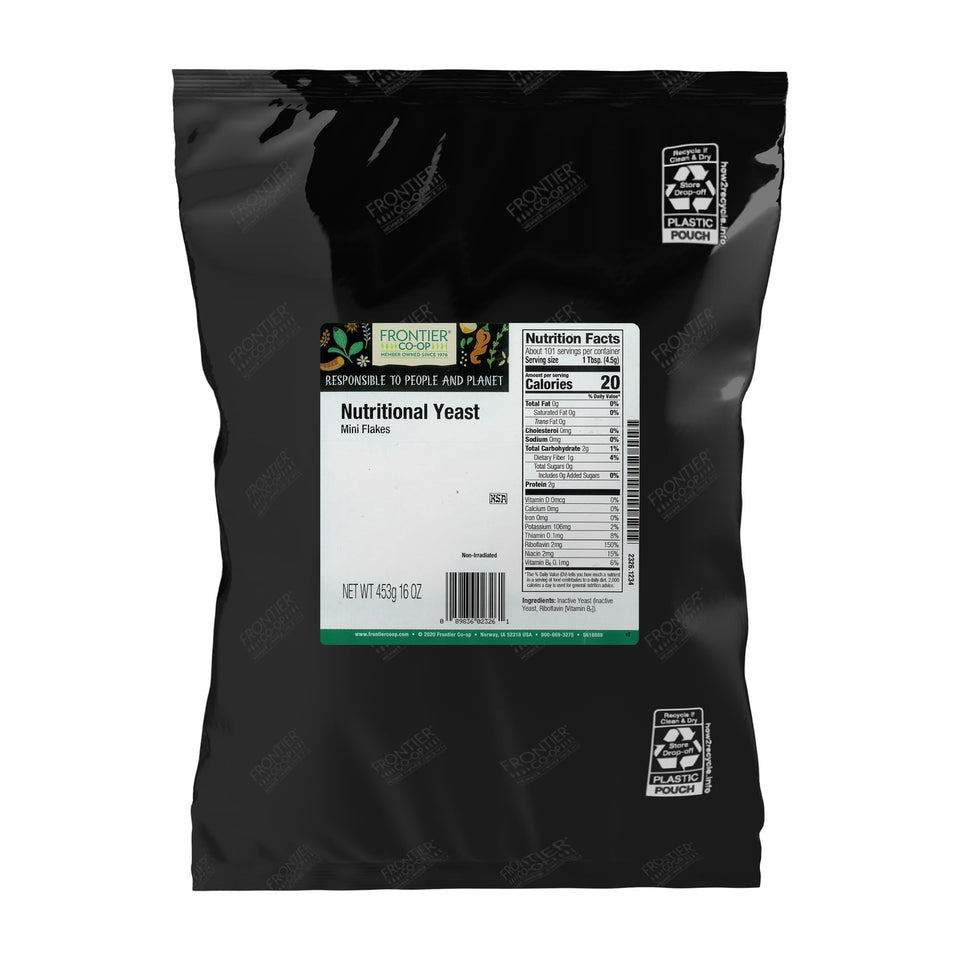 Frontier Co-op Nutritional Yeast Mini Flakes bag closeup, showcasing savory cheese-like flavor for toppings.
