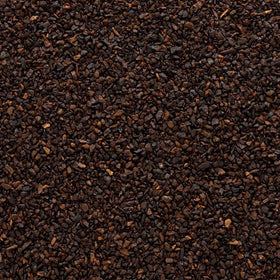 Close-up of roasted chicory root granules showing caramelized, nutty texture