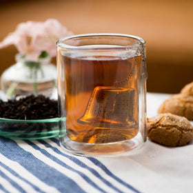 Steeped Frontier Co-op Ceylon tea with coppery red color and bold aroma.