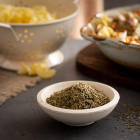 Frontier Co-op Thyme Leaf sprinkled into a simmering soup.