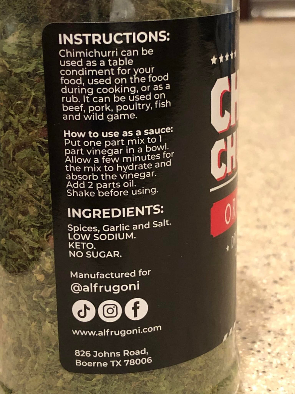 Frugoni Chimichurri Original dry rub on meat demonstrating herbaceous flavor potential.