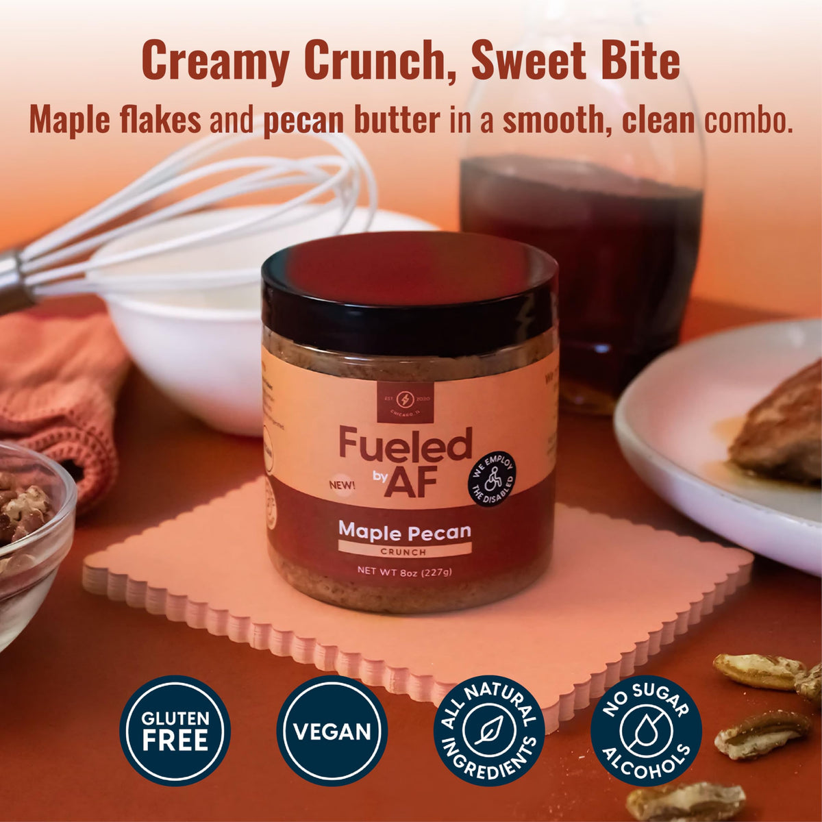 Fueled by AF Maple Pecan Crunch Butter jar label close-up, highlights vegan ingredients.