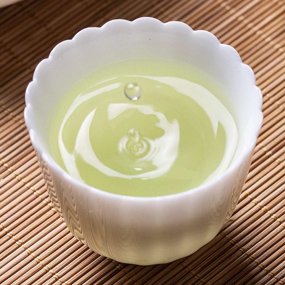 FullChea Mao Feng dry tea closeup reveals floral notes and a gentle, inviting aroma.