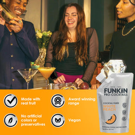 Close-up of Funkin Puree beside fresh peaches and herbs