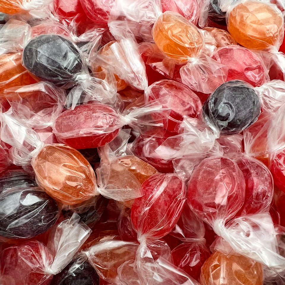 FUNTASTY Assorted Fruit Drops Orange candy in a bowl, ideal for party snacks and quick grabs.