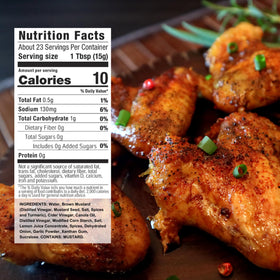 Pouring G Hughes Lemon Herb Marinade over chicken for grilling.