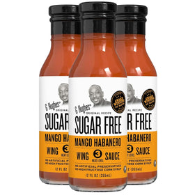 G Hughes Mango Habanero Wing Sauce bottle pour enhances wings with sugar-free heat.