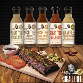 G Hughes Orange Ginger Marinade bottle showcases bold orange color and aroma.