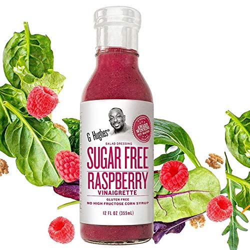 G Hughes Sugar Free Raspberry Vinaigrette dressing pour illustrate versatile use on greens